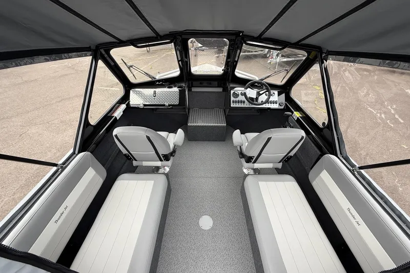 Slide: The Image of Interior of 2026 Thunder Jet 185 Luxor boat, featuring seating and steering console. - 6