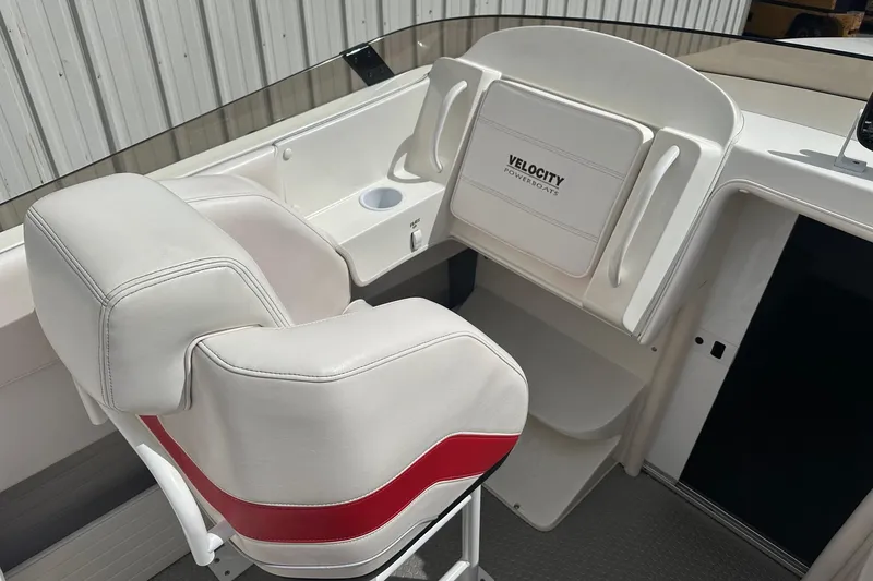 Slide: The Image of White and red seating on 1998 Velocity 26 Thoroughbred powerboat interior. - 14