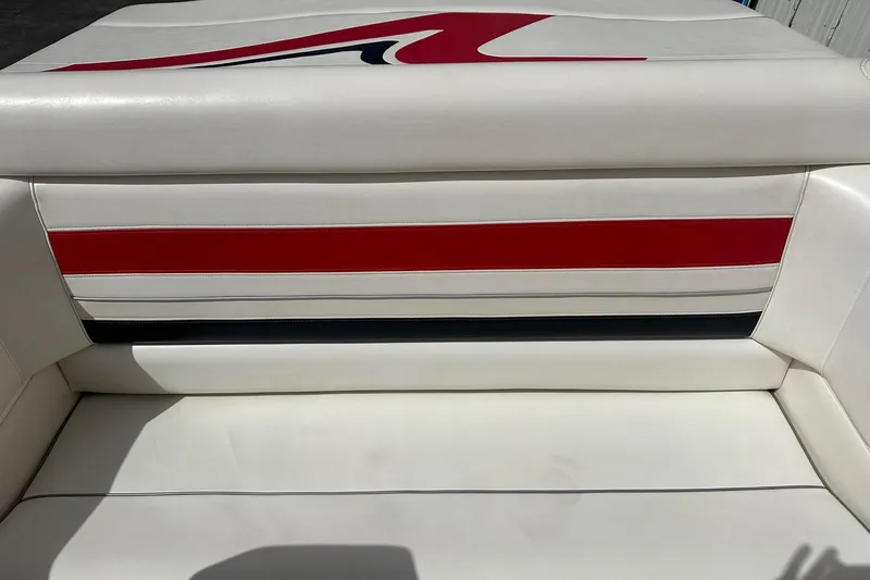 Slide: The Image of White and red interior seating of a 1998 Velocity 26 Thoroughbred boat. - 16