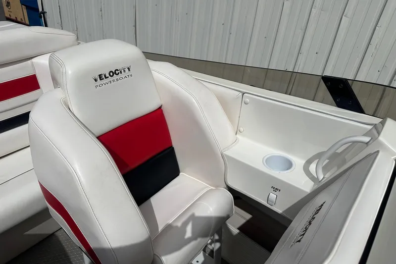 Slide: The Image of 1998 Velocity 26 Thoroughbred boat interior with white and red seating. - 18