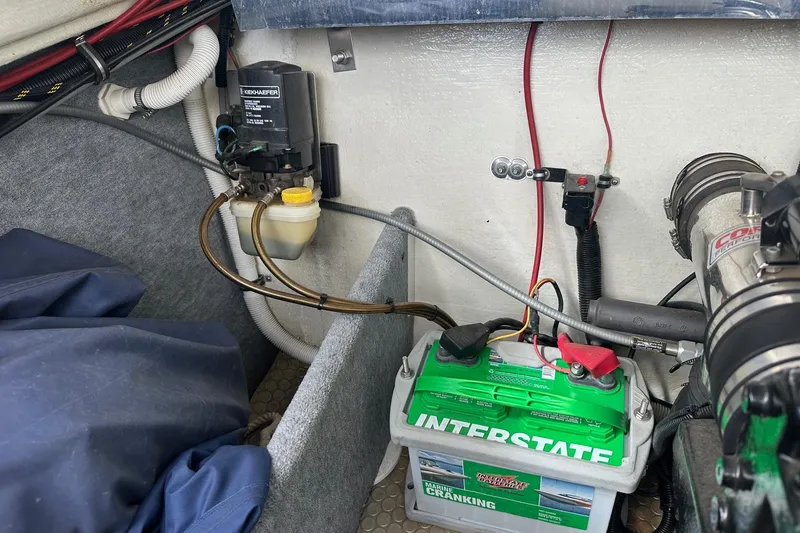 Slide: The Image of Engine compartment of 1998 Velocity 26 Thoroughbred with battery and wiring. - 22