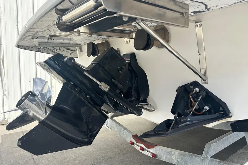 Slide: The Image of 1998 Velocity 26 Thoroughbred boat stern with propeller and trim tabs. - 9
