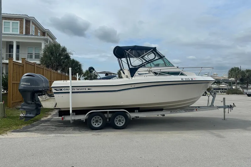The Image of 1987 Grady-White Gulfstream 232 boat on trailer with Yamaha outboard motor. - 0