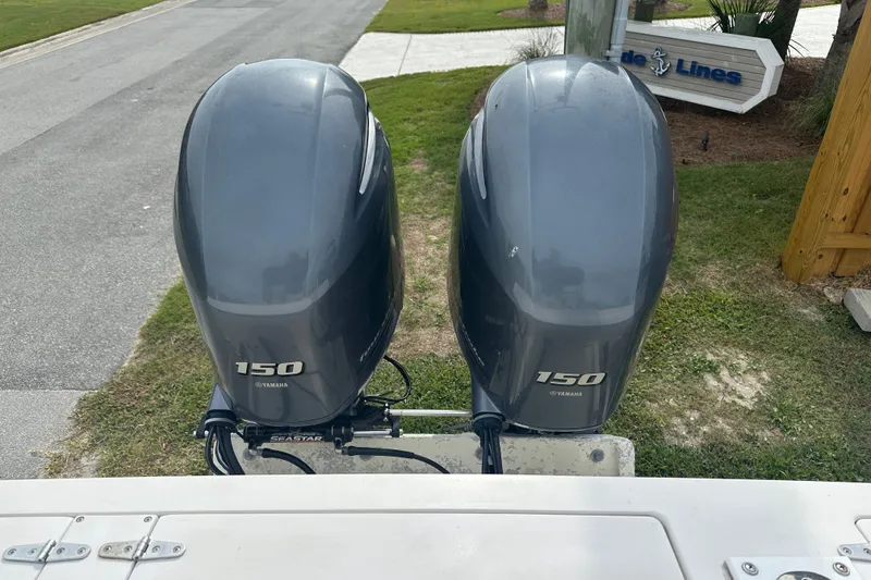 Slide: The Image of Twin Yamaha 150 outboard motors on a 1987 Grady-White Gulfstream 232 boat. - 12