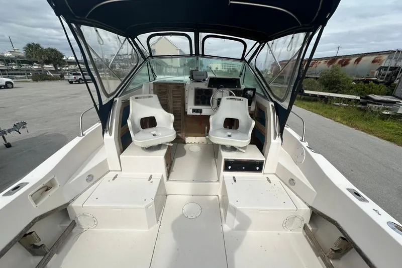 Slide: The Image of 1987 Grady-White Gulfstream 232 boat interior with dual seats and control panel. - 23