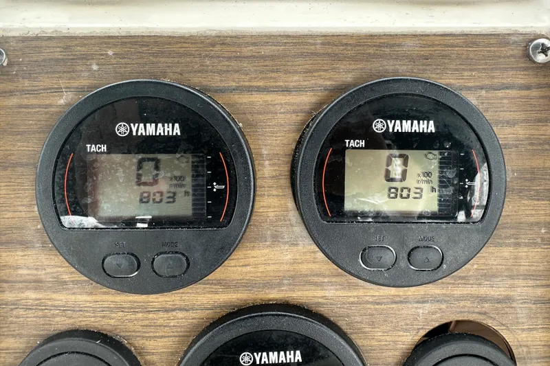 Slide: The Image of Yamaha tachometers on 1987 Grady-White Gulfstream 232 boat dashboard, showing 803 hours. - 31