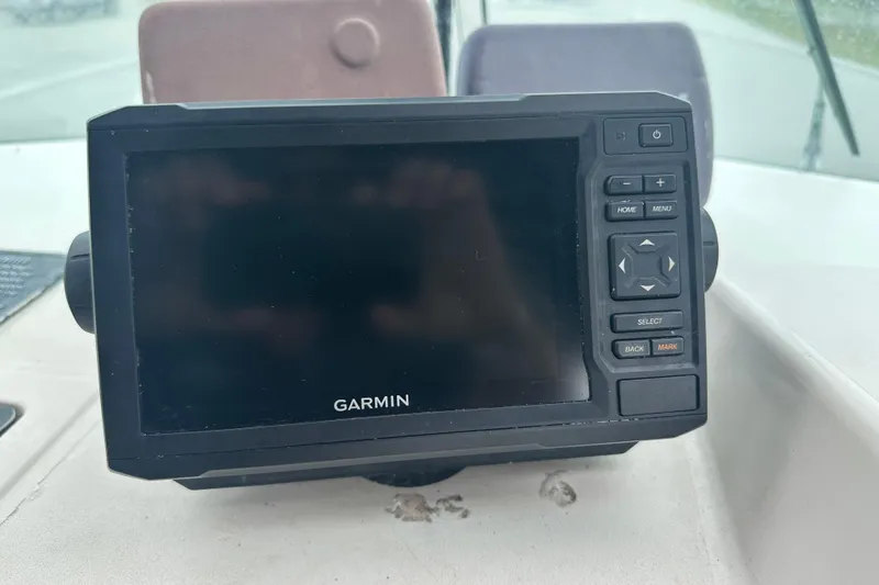 Slide: The Image of Garmin GPS device on 1987 Grady-White Gulfstream 232 boat dashboard. - 35