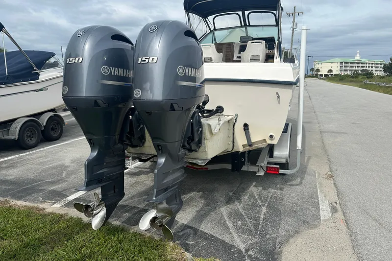 Slide: The Image of 1987 Grady-White Gulfstream 232 with twin Yamaha 150 engines on a trailer. - 7