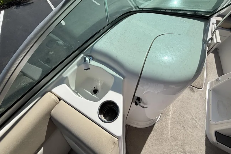 Slide: The Image of 2015 NauticStar 223 DC boat interior with sink and cup holder. - 21