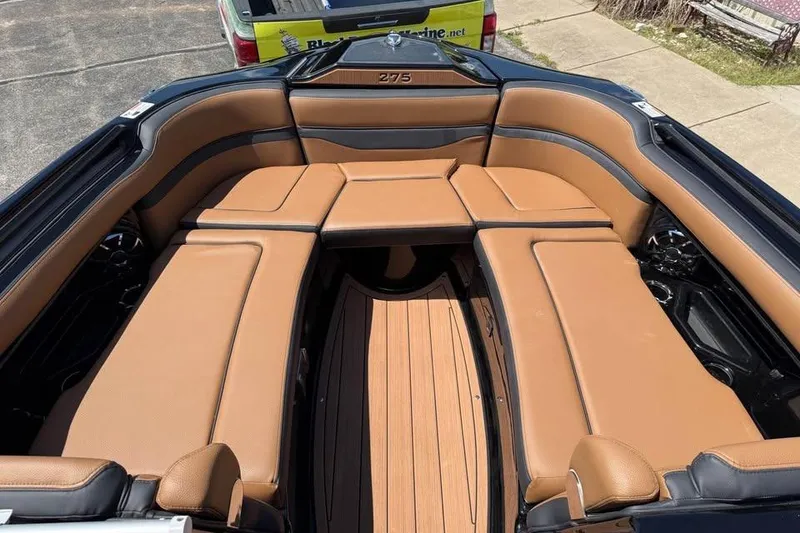 Slide: The Image of 2026 Yamaha Boats 275SD interior with tan seating and sleek design. - 12