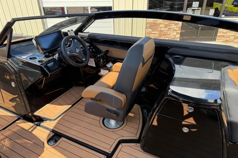 Slide: The Image of 2026 Yamaha Boats 275SD interior with sleek dashboard and luxurious seating. - 9
