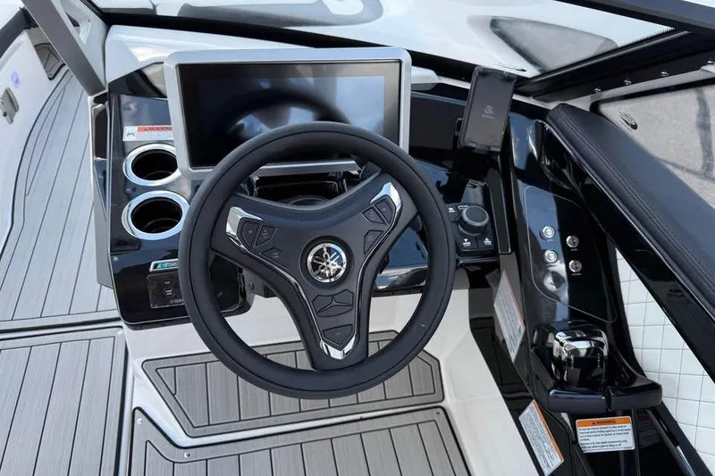 Slide: The Image of 2026 Yamaha Boats 275SD dashboard with steering wheel and touchscreen display. - 10