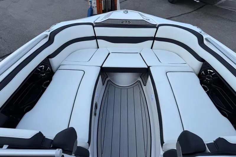 Slide: The Image of 2026 Yamaha Boats 275SD interior with sleek white seating and modern design. - 11
