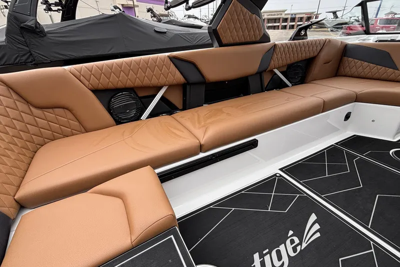 Slide: The Image of 2026 Tigé Z5 boat interior with luxurious brown leather seating and modern design. - 10