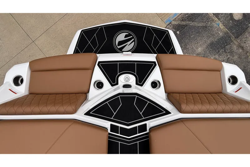 Slide: The Image of 2026 Tigé Z5 boat interior with brown seating and black deck design. - 12