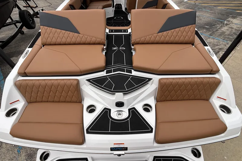 Slide: The Image of 2026 Tigé Z5 boat interior with luxurious brown seating and modern design. - 13