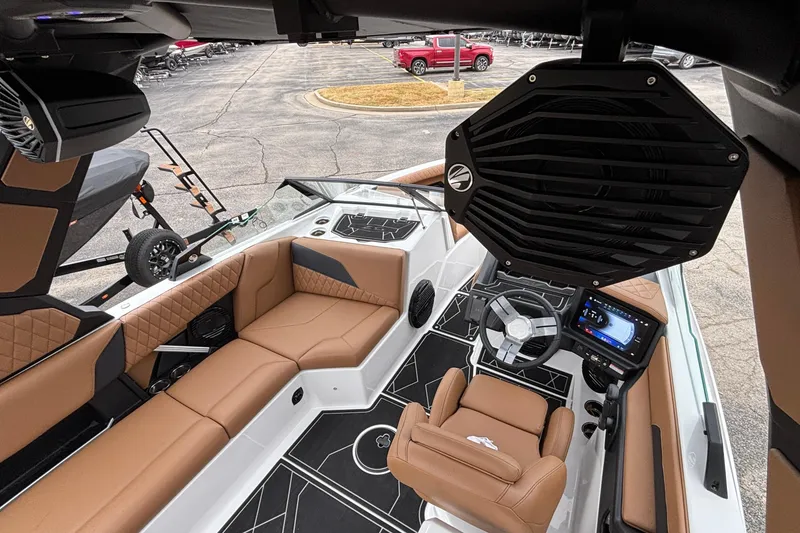 Slide: The Image of Interior of 2026 Tigé Z5 boat with luxurious seating and advanced dashboard controls. - 15