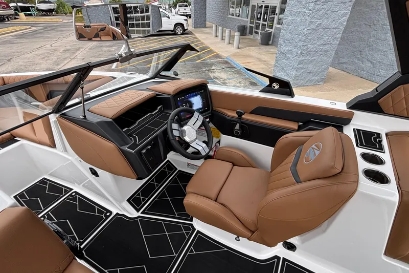 Slide: The Image of 2026 Tigé Z5 boat interior with brown leather seats and modern dashboard. - 18