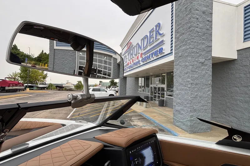 Slide: The Image of 2026 Tigé Z5 boat parked outside a marine boating center. - 20