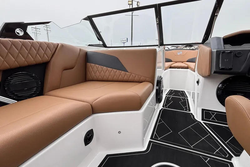 Slide: The Image of Luxurious interior of 2026 Tigé Z5 boat with brown leather seating and modern design. - 21
