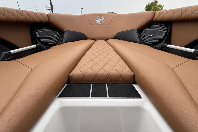 Slide: The Image of 2026 Tigé Z5 boat interior with tan quilted upholstery and integrated speakers. - 23