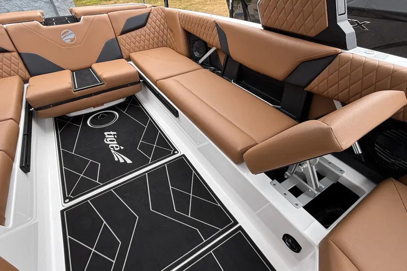 Slide: The Image of 2026 Tigé Z5 boat interior with luxurious brown seating and stylish black flooring. - 29