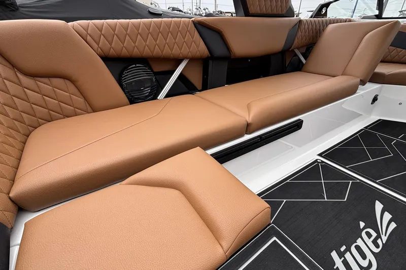 Slide: The Image of 2026 Tigé Z5 boat interior with luxurious tan leather seating and stylish design. - 30