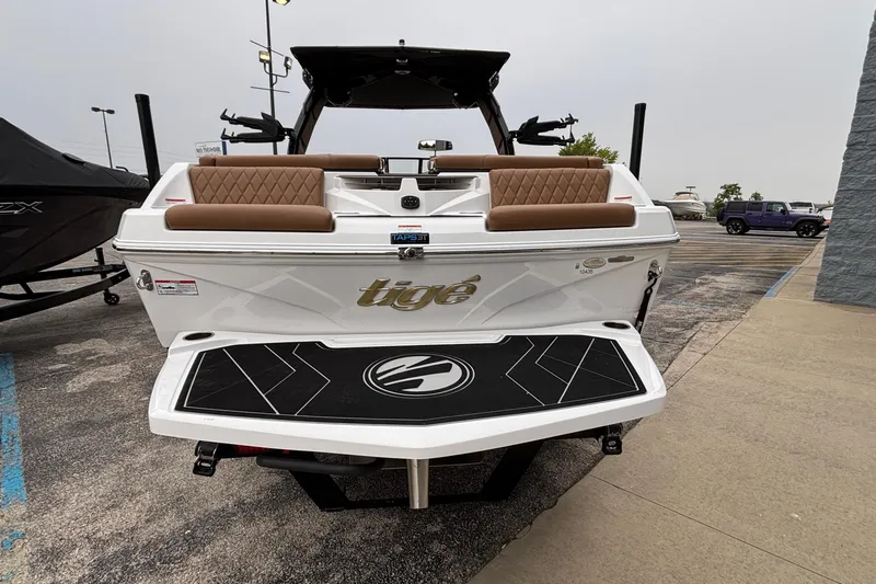 Slide: The Image of 2026 Tigé Z5 boat rear view with brown seating and black swim platform. - 39