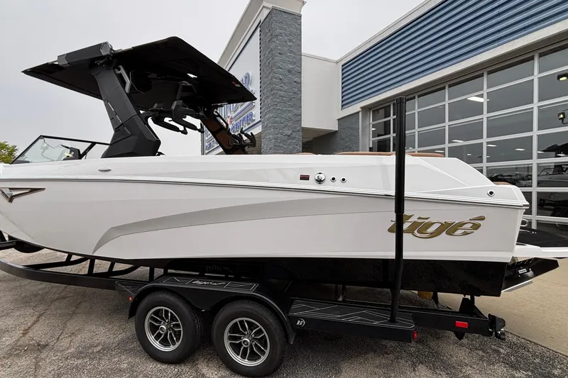 Slide: The Image of 2026 Tigé Z5 boat on trailer outside dealership, showcasing sleek design and modern features. - 41