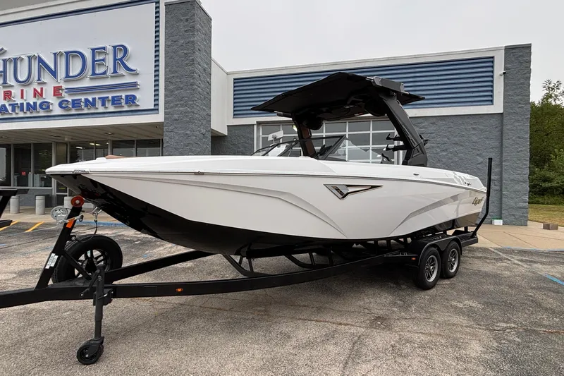 Slide: The Image of 2026 Tigé Z5 boat on trailer outside marine center. - 42