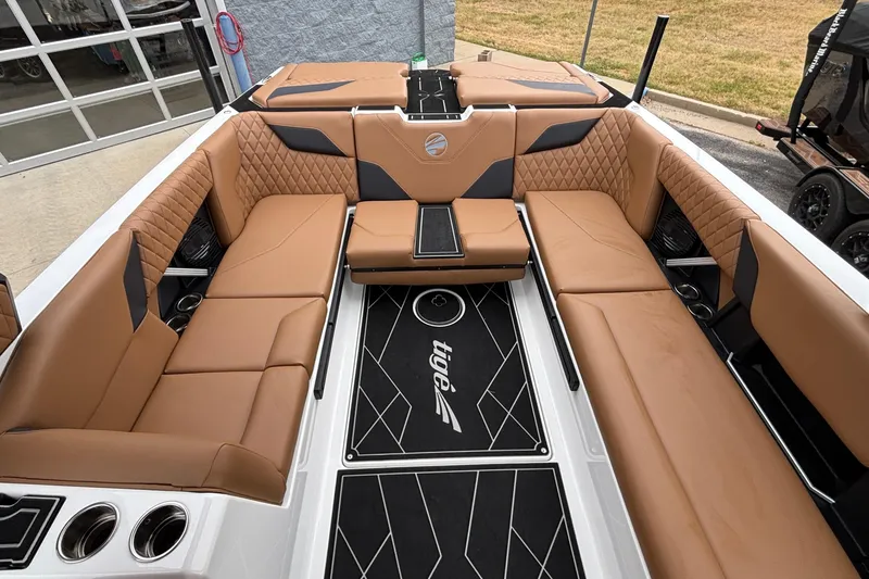 Slide: The Image of Luxurious interior of 2026 Tigé Z5 boat with tan leather seating and stylish design. - 7
