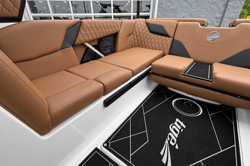 Slide: The Image of Luxurious interior of 2026 Tigé Z5 boat with brown leather seating and stylish design. - 8