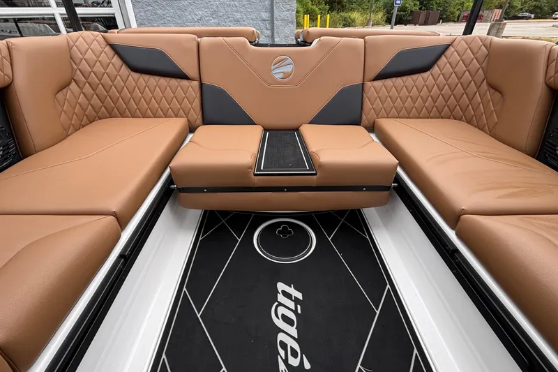 Slide: The Image of Luxurious interior of 2026 Tigé Z5 boat with tan quilted seating and sleek design. - 9