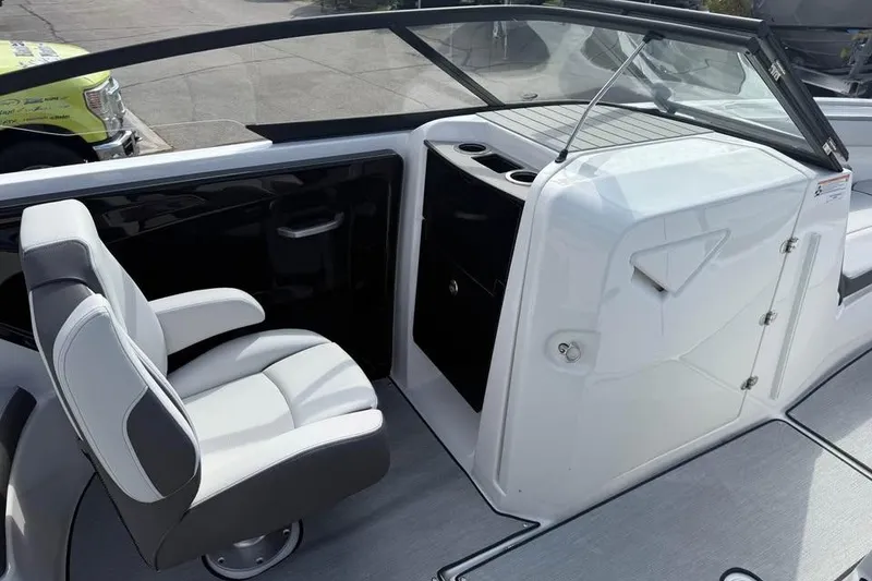 Slide: The Image of 2026 Yamaha Boats AR250 interior with sleek seating and modern dashboard design. - 10