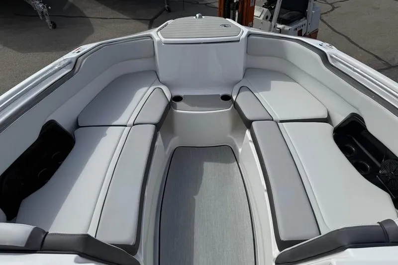 Slide: The Image of 2026 Yamaha Boats AR250 interior with spacious seating and modern design. - 11