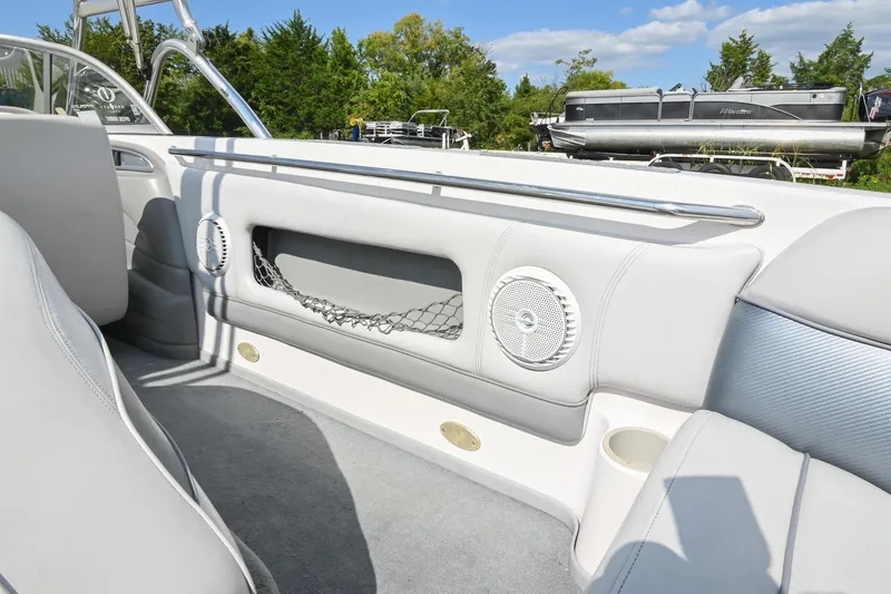 Slide: The Image of 2004 Supra Launch SS boat interior with speakers and storage netting. - 10