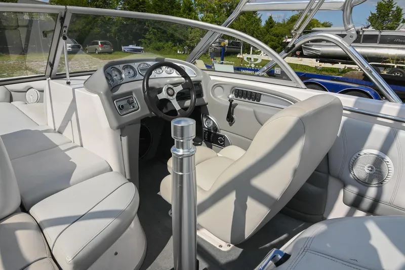 Slide: The Image of 2004 Supra Launch SS boat interior with steering wheel and seating. - 15