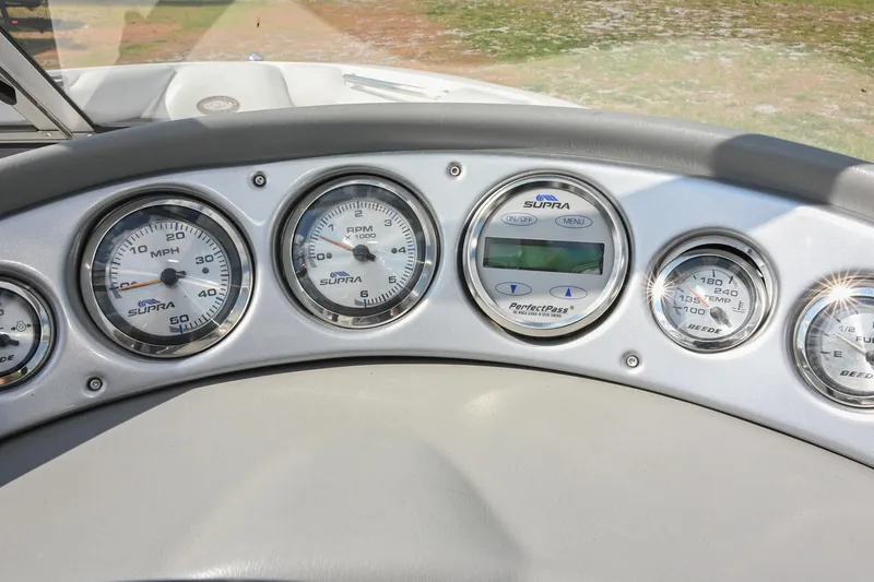Slide: The Image of Dashboard of a 2004 Supra Launch SS boat with speedometer and gauges. - 19