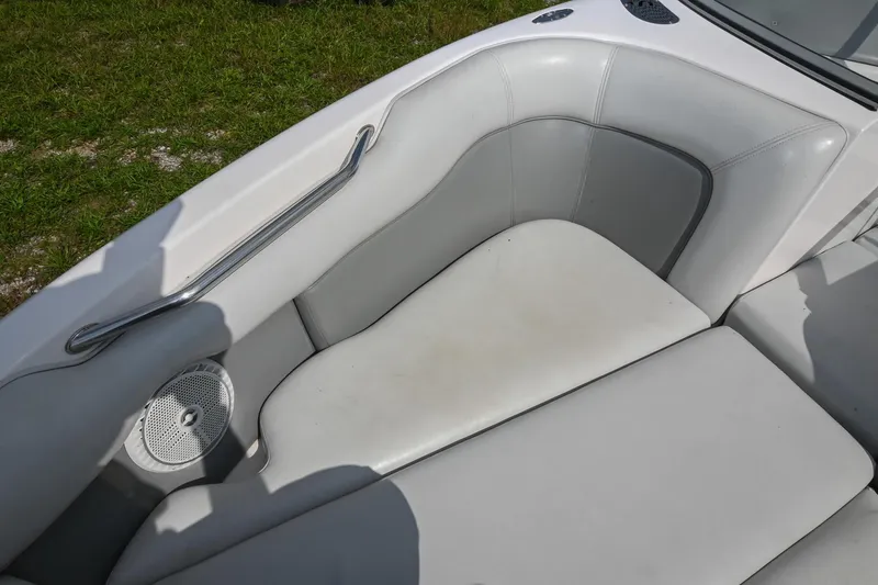 Slide: The Image of 2004 Supra Launch SS boat interior with white leather seating and speaker. - 25
