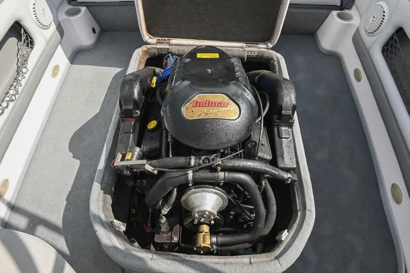 Slide: The Image of 2004 Supra Launch SS boat engine compartment with Indmar engine, showcasing detailed components. - 26