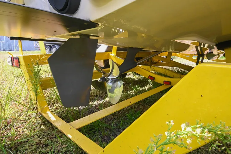 Slide: The Image of 2004 Supra Launch SS boat propeller and rudder on yellow trailer. - 28