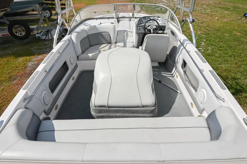 Slide: The Image of 2004 Supra Launch SS boat interior with white seating and steering wheel. - 7