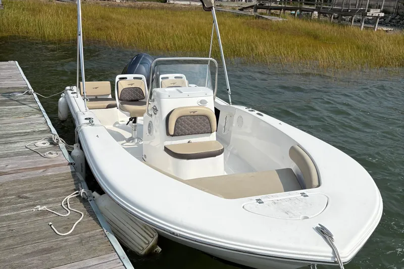 Slide: The Image of 2022 Tidewater 180 CC Adventure boat docked by the water. - 3