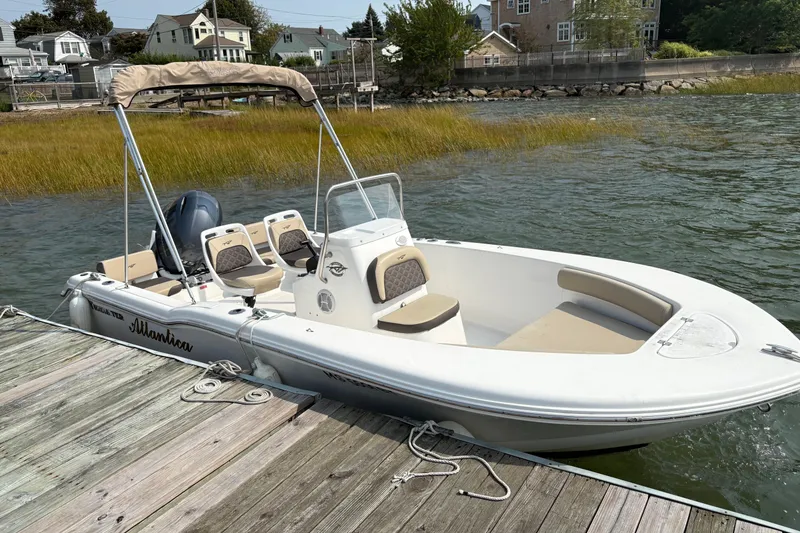 Slide: The Image of 2022 Tidewater 180 CC Adventure boat docked by the water. - 4