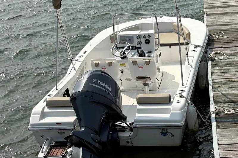 Slide: The Image of 2022 Tidewater 180 CC Adventure boat docked with Yamaha outboard motor. - 7