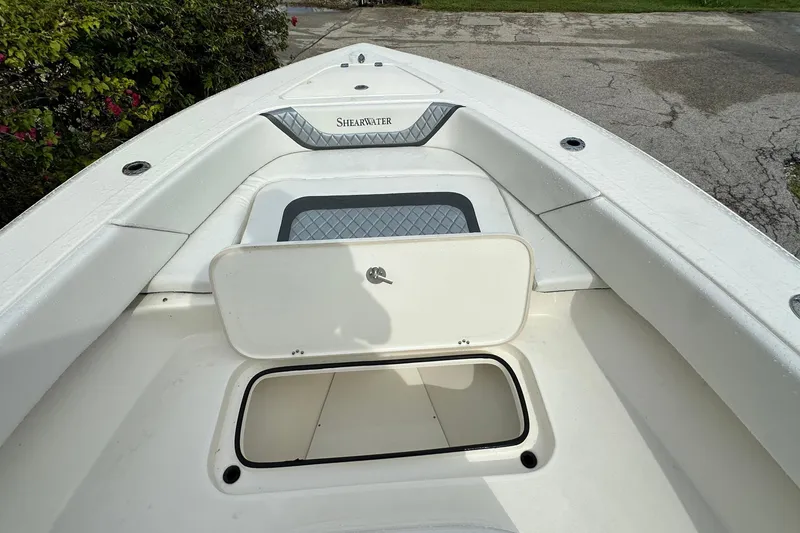 Slide: The Image of 2026 ShearWater 270 SS Open boat deck with storage compartment open. - 15