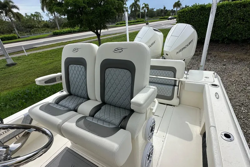 Slide: The Image of 2026 ShearWater 270 SS Open boat with dual Mercury engines and luxury seating. - 17