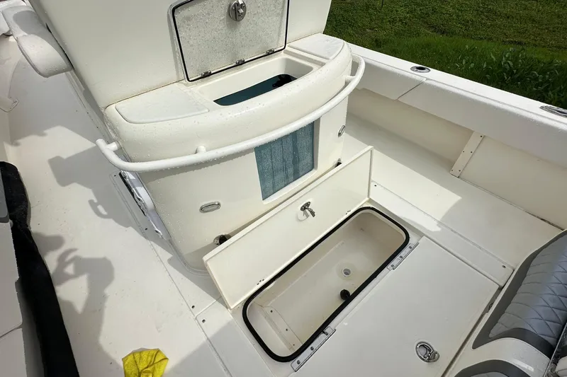 Slide: The Image of 2026 ShearWater 270 SS Open boat interior with storage compartments and seating. - 20