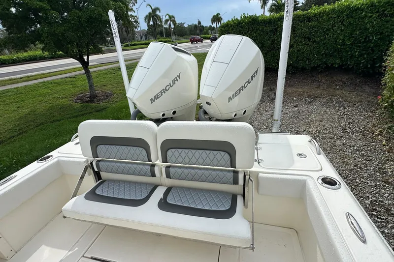 Slide: The Image of 2026 ShearWater 270 SS Open boat with dual Mercury engines and cushioned seating. - 21