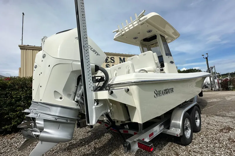 Slide: The Image of 2026 ShearWater 270 SS Open boat on trailer, featuring powerful Mercury engine. - 3